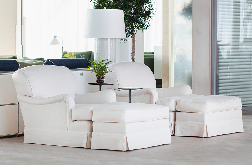 White slipcovered online chair and ottoman